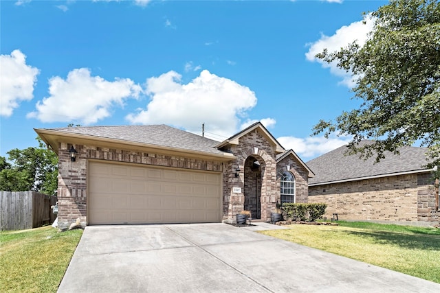 23307 W Pine Ivy Ln, Tomball, TX 77375 - view of front facade with brick siding, driveway, and an attached garage