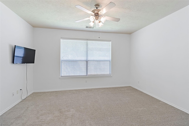 23307 W Pine Ivy Ln, Tomball, TX 77375 - carpeted spare room with a textured ceiling and a ceiling fan
