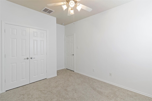23307 W Pine Ivy Ln, Tomball, TX 77375 - unfurnished bedroom with carpet flooring, a closet, and a ceiling fan