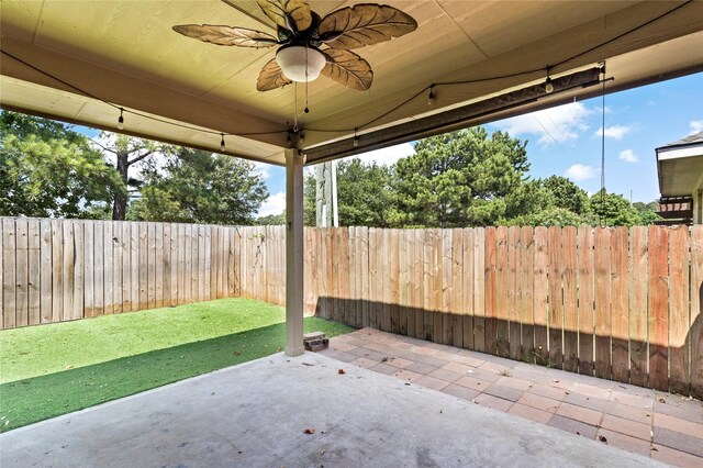 23307 W Pine Ivy Ln, Tomball, TX 77375 - fenced backyard with a patio area and a ceiling fan