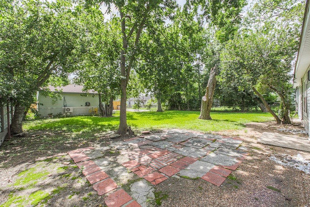 4330 Heite St, Houston, TX 77022 - view of grassy yard with a patio