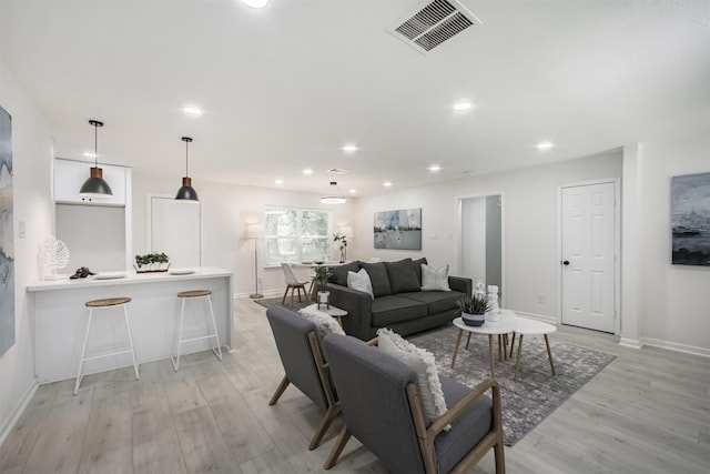 4330 Heite St, Houston, TX 77022 - living room with light wood finished floors and recessed lighting