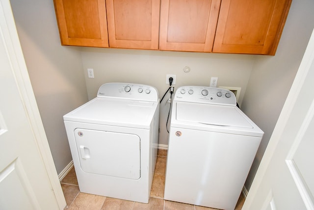 5615 Winsome Ln Unit C, Houston, TX 77057 - washroom featuring independent washer and dryer, cabinet space, and light tile patterned floors