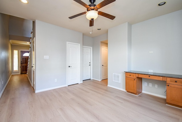5615 Winsome Ln Unit C, Houston, TX 77057 - unfurnished bedroom featuring light wood-style floors, built in study area, recessed lighting, and ceiling fan
