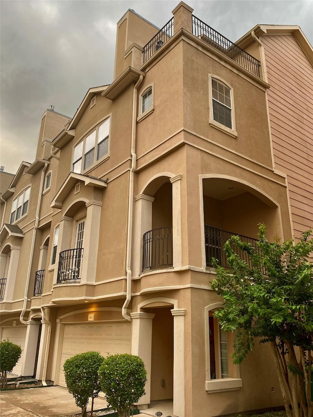 5615 Winsome Ln Unit C, Houston, TX 77057 - view of building exterior featuring a garage