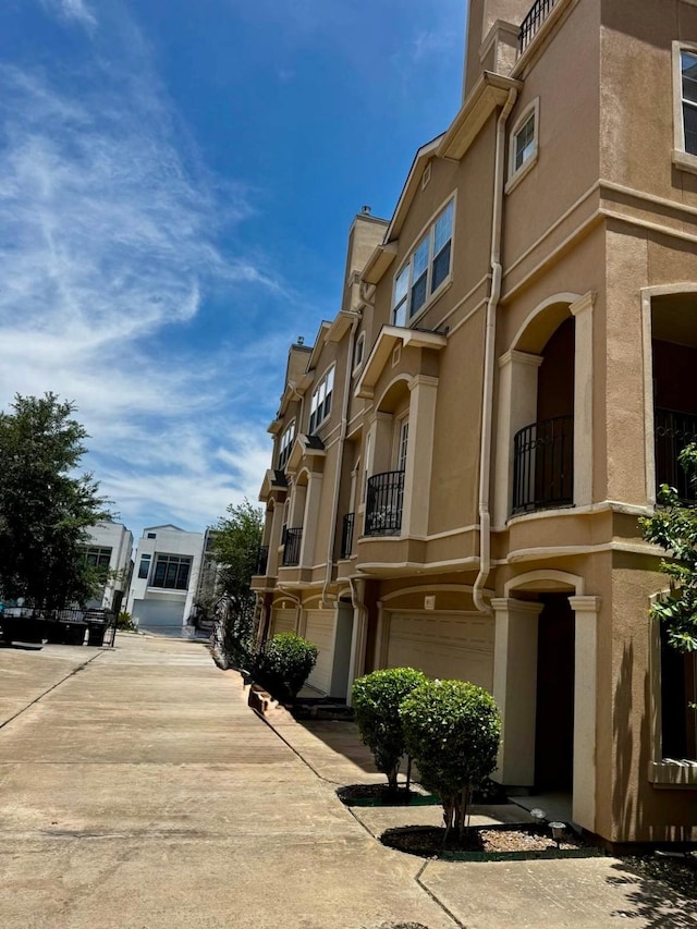 5615 Winsome Ln Unit C, Houston, TX 77057 - view of building exterior featuring an attached garage