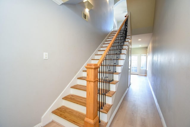 5615 Winsome Ln Unit C, Houston, TX 77057 - staircase with wood finished floors, arched walkways, and a towering ceiling