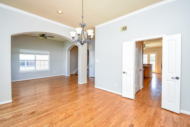 5615 Winsome Ln Unit C, Houston, TX 77057 - unfurnished room featuring arched walkways, a ceiling fan, ornamental molding, light wood-style floors, and a chandelier