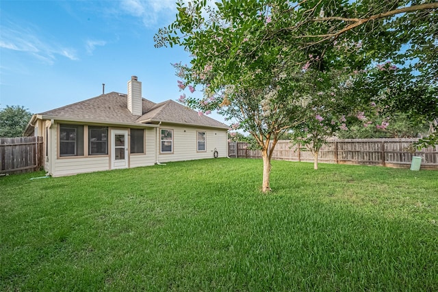 30606 S Sulphur Creek Dr, Magnolia, TX 77355 - back of property with a chimney, a fenced backyard, and a shingled roof