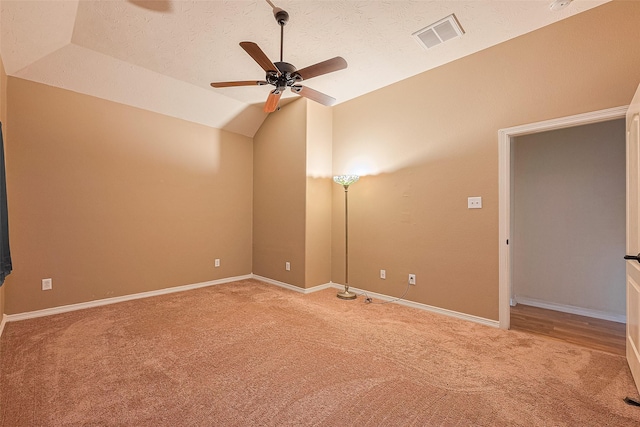 30606 S Sulphur Creek Dr, Magnolia, TX 77355 - carpeted empty room featuring lofted ceiling, ceiling fan, and a textured ceiling