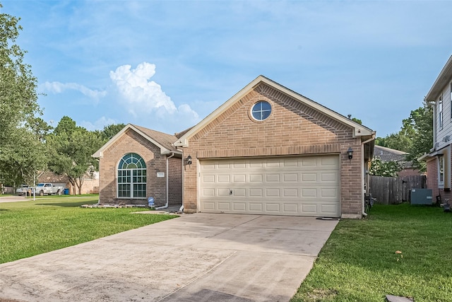 30606 S Sulphur Creek Dr, Magnolia, TX 77355 - view of front of house with brick siding, concrete driveway, and a garage