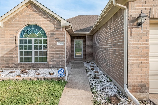 30606 S Sulphur Creek Dr, Magnolia, TX 77355 - view of exterior entry with brick siding and a shingled roof
