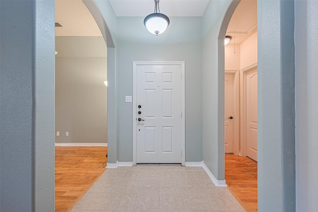 30606 S Sulphur Creek Dr, Magnolia, TX 77355 - entrance foyer with arched walkways and light wood finished floors