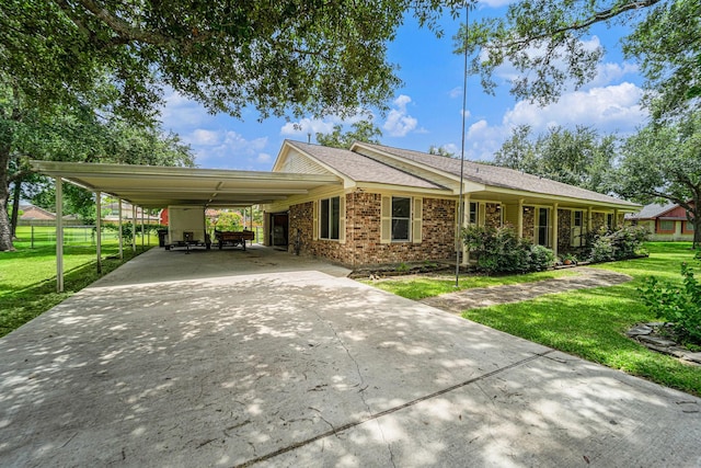2505 Mary Ave, Pearland, TX 77581 - view of front facade with concrete driveway, brick siding, and an attached carport