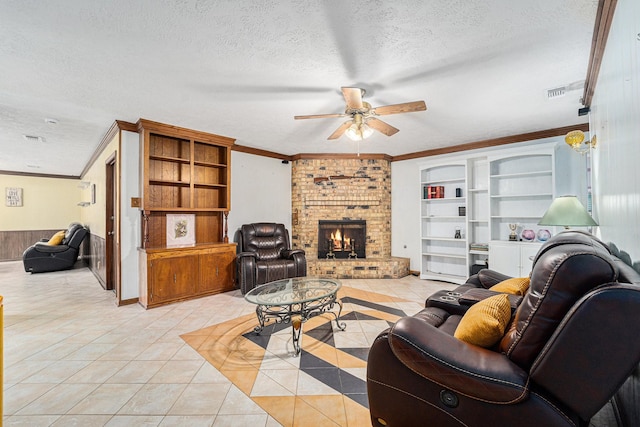 2505 Mary Ave, Pearland, TX 77581 - living area with a textured ceiling, ceiling fan, light tile patterned flooring, crown molding, and a brick fireplace