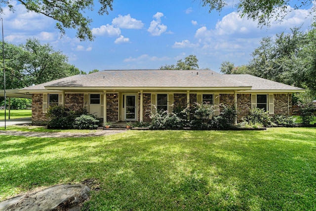2505 Mary Ave, Pearland, TX 77581 - ranch-style house featuring a front lawn, an attached carport, and brick siding