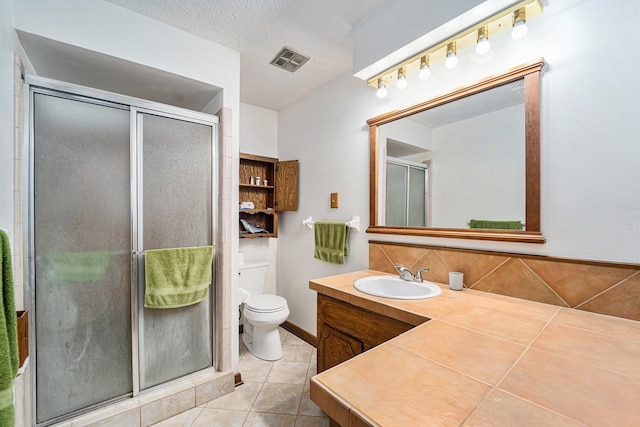 2505 Mary Ave, Pearland, TX 77581 - bathroom with tile patterned floors, vanity, a shower stall, and tasteful backsplash