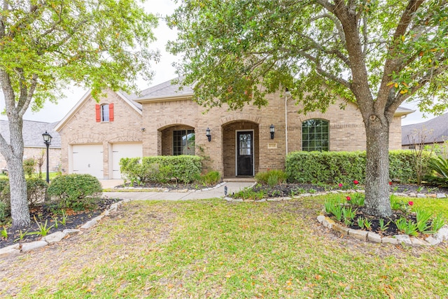 2715 Joshua Tree Ln, Manvel, TX 77578 - view of front facade with brick siding and a front lawn