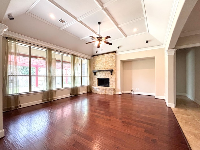 2715 Joshua Tree Ln, Manvel, TX 77578 - unfurnished living room featuring coffered ceiling, ceiling fan, wood finished floors, a stone fireplace, and decorative columns