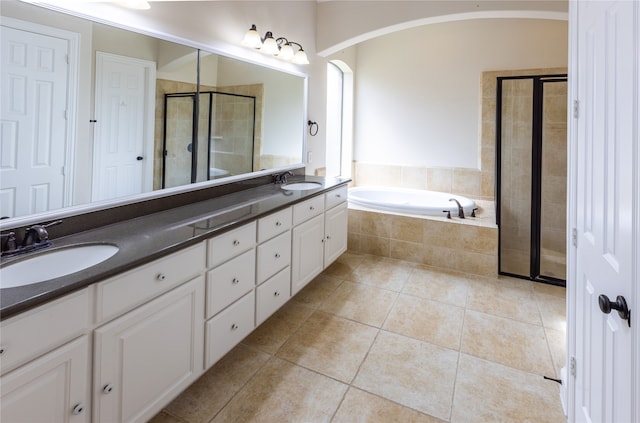 2715 Joshua Tree Ln, Manvel, TX 77578 - full bath with double vanity, a stall shower, a bath, and tile patterned flooring