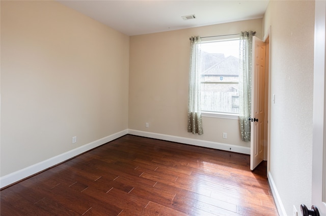 2715 Joshua Tree Ln, Manvel, TX 77578 - spare room featuring dark wood-type flooring and baseboards