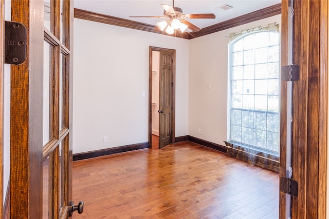 2715 Joshua Tree Ln, Manvel, TX 77578 - spare room featuring crown molding, wood finished floors, and ceiling fan