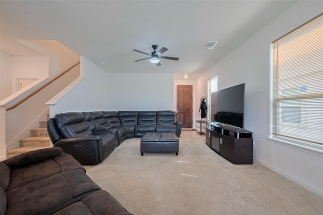 602 Willow Briar Dr, Houston, TX 77090 - living room with light carpet, ceiling fan, plenty of natural light, and stairway