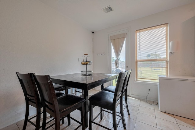 602 Willow Briar Dr, Houston, TX 77090 - dining space with baseboards and light tile patterned floors