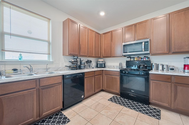 602 Willow Briar Dr, Houston, TX 77090 - kitchen with black appliances, light tile patterned floors, light countertops, and recessed lighting
