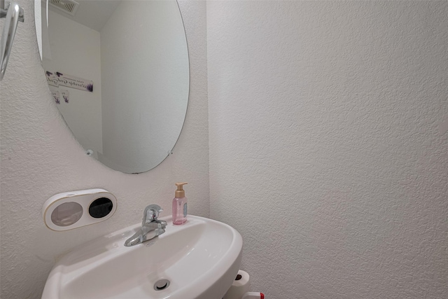 602 Willow Briar Dr, Houston, TX 77090 - bathroom with a sink and a textured wall