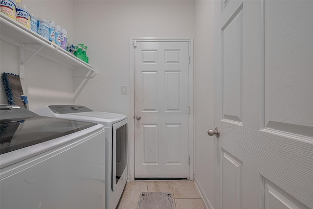 602 Willow Briar Dr, Houston, TX 77090 - washroom featuring washing machine and clothes dryer and light tile patterned floors