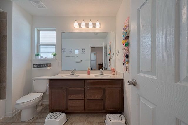602 Willow Briar Dr, Houston, TX 77090 - bathroom with double vanity and tile patterned floors