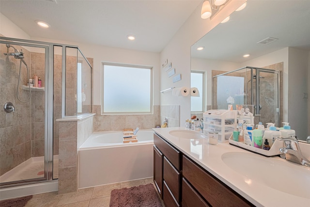 602 Willow Briar Dr, Houston, TX 77090 - full bathroom featuring a bath, a stall shower, double vanity, tile patterned flooring, and recessed lighting