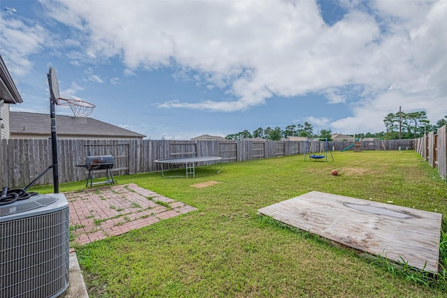 602 Willow Briar Dr, Houston, TX 77090 - fenced backyard featuring a trampoline, a patio, and a playground