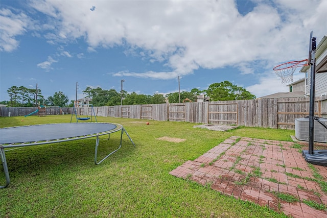 602 Willow Briar Dr, Houston, TX 77090 - fenced backyard featuring a trampoline, a playground, and a patio