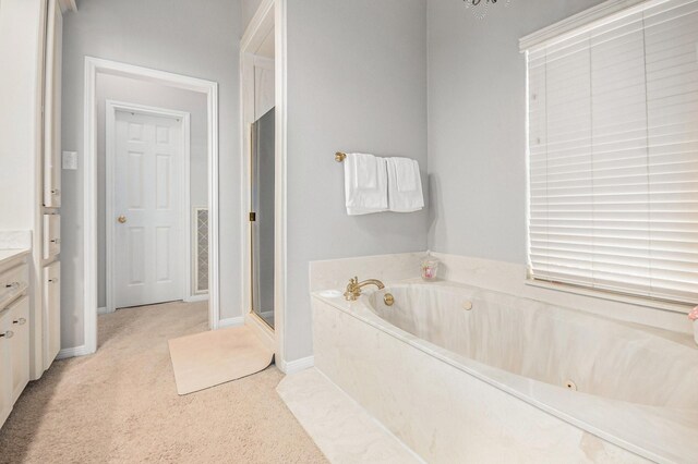 2722 Masters Dr, League City, TX 77573 - full bath featuring vanity, a garden tub, and a shower stall