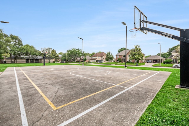 2722 Masters Dr, League City, TX 77573 - view of basketball court featuring community basketball court, a lawn, and a residential view