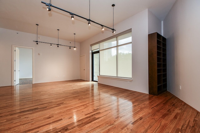 5005 Hidalgo St Unit 210, Houston, TX 77056 - spare room featuring light wood finished floors and rail lighting