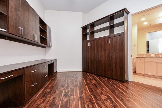 5005 Hidalgo St Unit 210, Houston, TX 77056 - kitchen with open shelves, dark wood-type flooring, and dark brown cabinetry