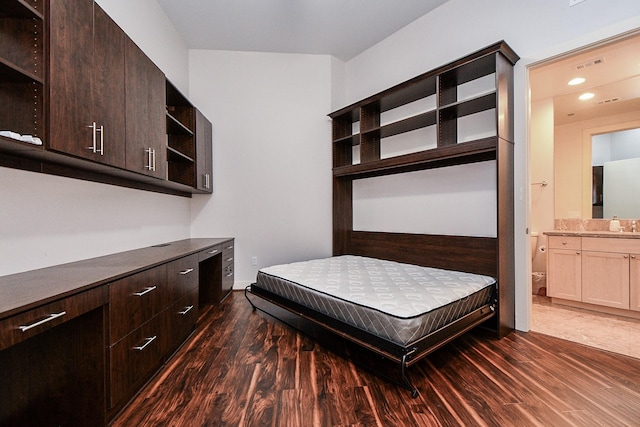 5005 Hidalgo St Unit 210, Houston, TX 77056 - bedroom with dark wood finished floors and ensuite bathroom