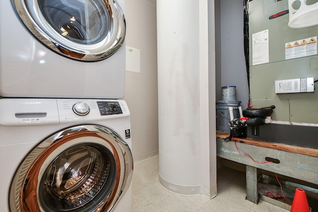 5005 Hidalgo St Unit 210, Houston, TX 77056 - laundry area with stacked washing machine and dryer and heating unit
