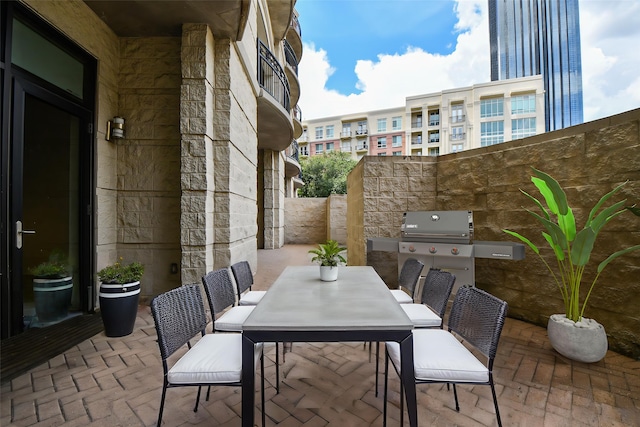 5005 Hidalgo St Unit 210, Houston, TX 77056 - view of patio / terrace featuring outdoor dining space and area for grilling
