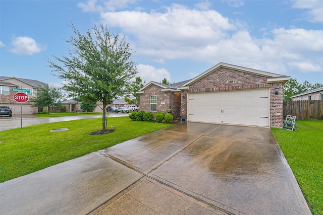 21118 Baltic Rain Dr, Hockley, TX 77447 - view of front of home with brick siding, driveway, and an attached garage