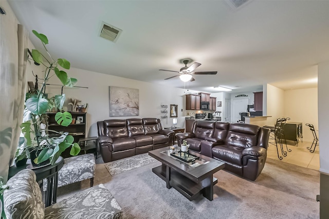 21118 Baltic Rain Dr, Hockley, TX 77447 - living area with a ceiling fan and light colored carpet