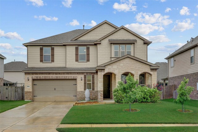 3905 Chartham Ln, Pearland, TX 77584 - view of front facade featuring driveway, an attached garage, brick siding, a shingled roof, and stone siding