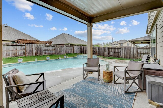 3905 Chartham Ln, Pearland, TX 77584 - view of swimming pool featuring a fenced backyard, a patio, and a pool with connected hot tub