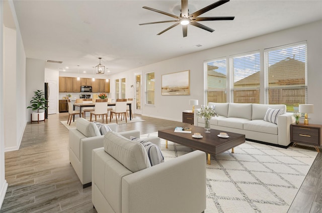 3905 Chartham Ln, Pearland, TX 77584 - living area with light wood-type flooring, a ceiling fan, and recessed lighting