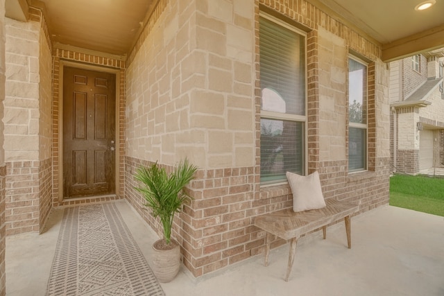3905 Chartham Ln, Pearland, TX 77584 - view of exterior entry with covered porch and brick siding
