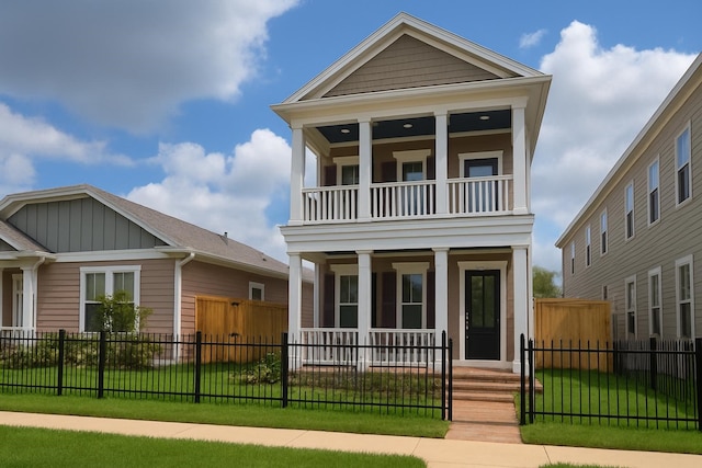 2519 S Houston Ave, Pearland, TX 77581 - view of front of property featuring covered porch, a balcony, board and batten siding, and a fenced front yard