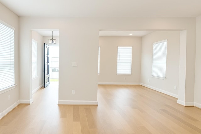 2519 S Houston Ave, Pearland, TX 77581 - spare room with light wood-style floors and plenty of natural light